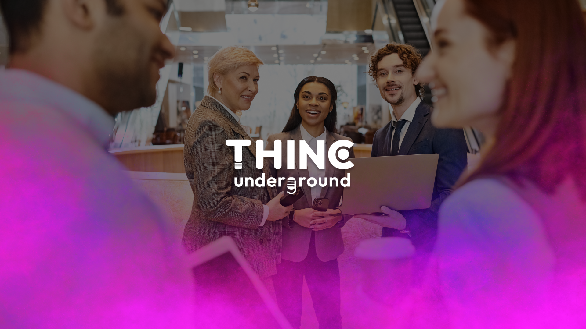 5 professionals standing and mingling